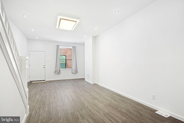 spare room featuring hardwood / wood-style flooring