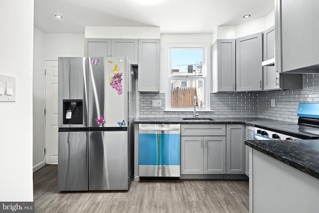 kitchen with stainless steel appliances, gray cabinets, and sink