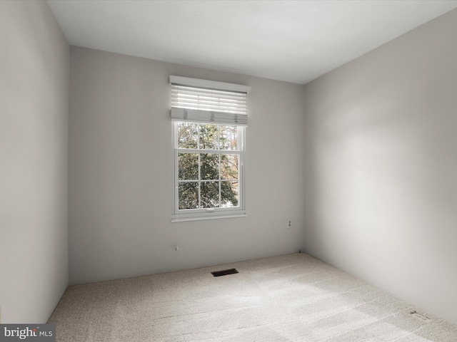 unfurnished room featuring carpet flooring