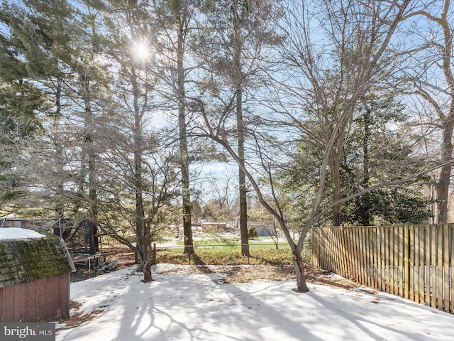 snow covered patio featuring a trampoline