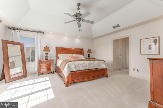 bedroom featuring baseboards, visible vents, light carpet, and lofted ceiling