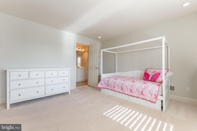 carpeted bedroom featuring recessed lighting, baseboards, and ensuite bathroom