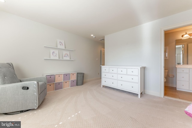 sitting room featuring carpet flooring, visible vents, and baseboards