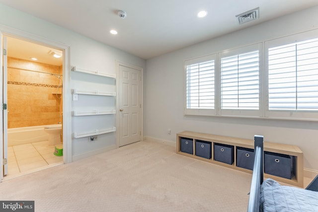 carpeted bedroom featuring recessed lighting, visible vents, baseboards, and ensuite bath