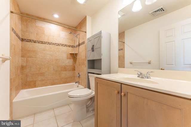 bathroom with tile patterned floors, visible vents, toilet, washtub / shower combination, and vanity