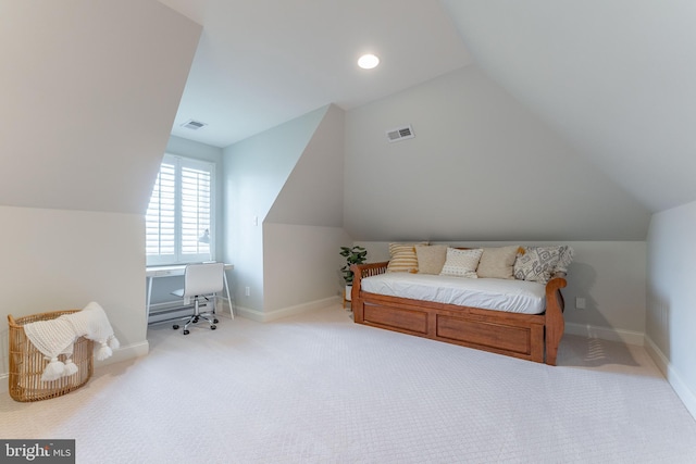 carpeted bedroom featuring lofted ceiling, baseboards, and visible vents