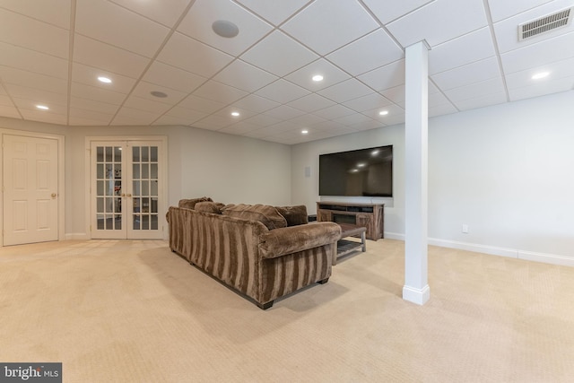 living room featuring visible vents, baseboards, recessed lighting, french doors, and light colored carpet