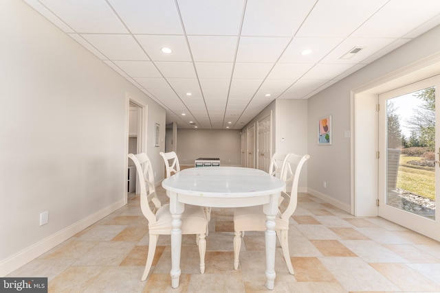 dining room featuring plenty of natural light, recessed lighting, baseboards, and a paneled ceiling