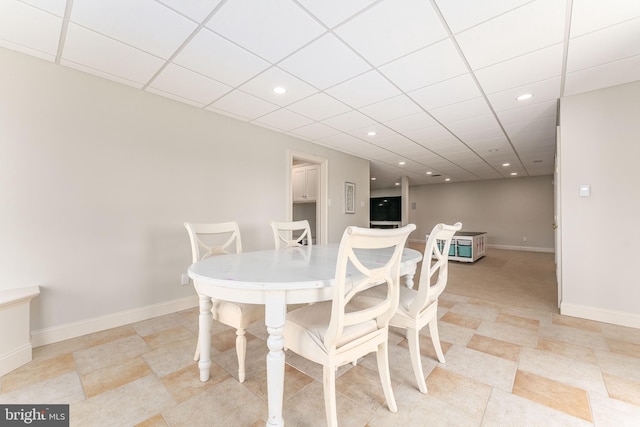 dining area featuring recessed lighting, a drop ceiling, and baseboards