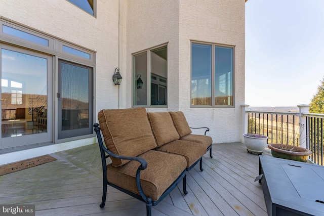 wooden deck featuring an outdoor living space