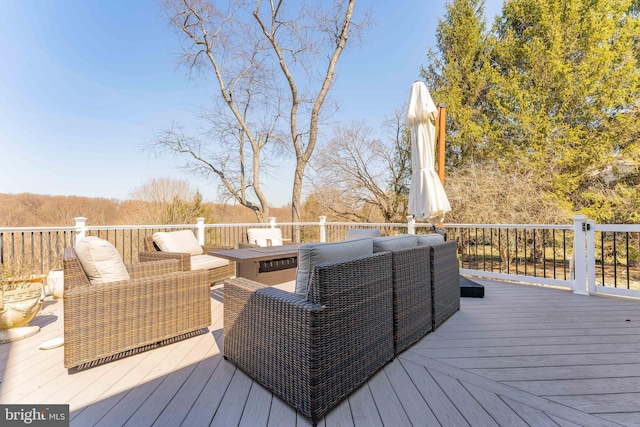 wooden deck with an outdoor hangout area