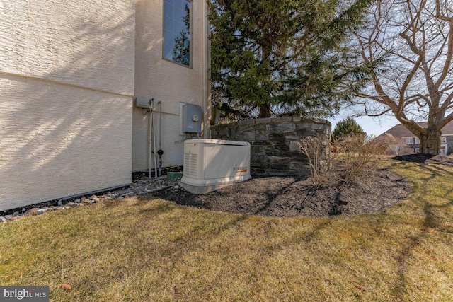 view of home's exterior with a lawn and stucco siding