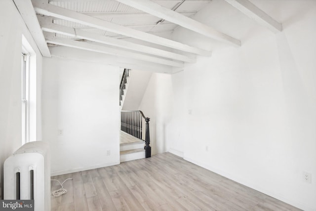 interior space with radiator and light hardwood / wood-style flooring