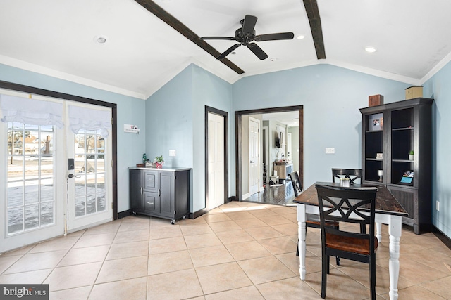 dining area with crown molding, ceiling fan, lofted ceiling, and light tile patterned floors