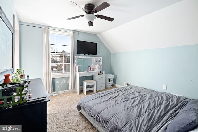 carpeted bedroom featuring lofted ceiling and ceiling fan