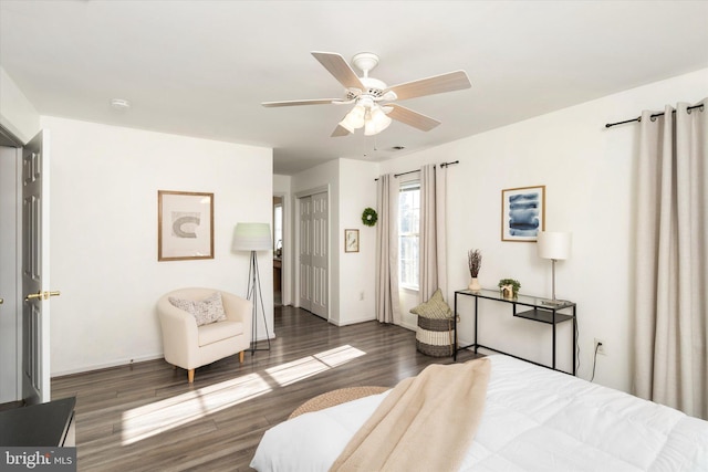 bedroom featuring dark hardwood / wood-style flooring and ceiling fan