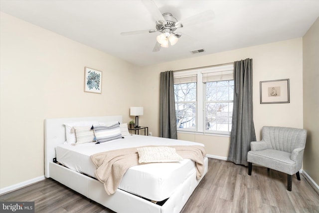 bedroom featuring hardwood / wood-style flooring and ceiling fan