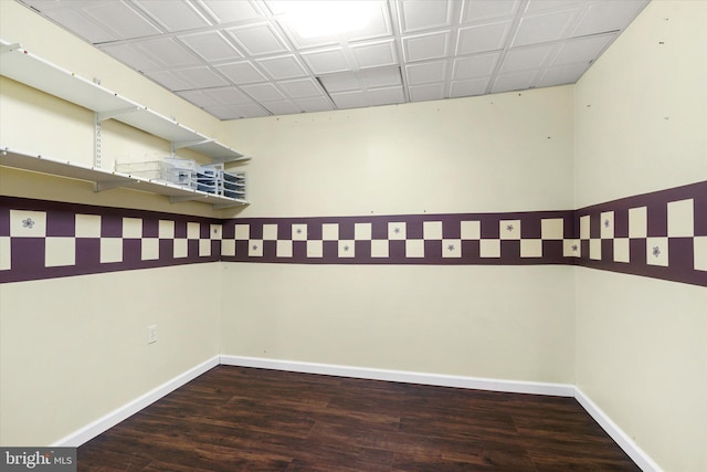 empty room with dark wood-type flooring