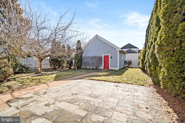 view of patio featuring an outbuilding