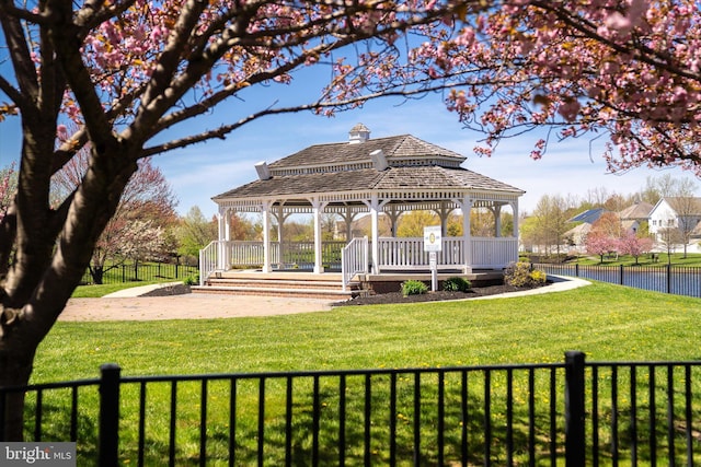 view of property's community with a gazebo and a lawn