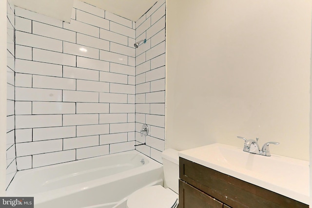 full bathroom with tiled shower / bath combo, vanity, and toilet