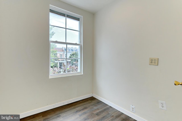 empty room with dark wood-type flooring