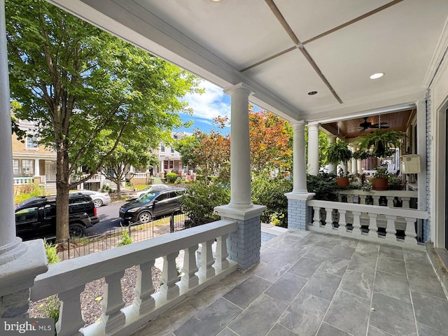 view of patio featuring ceiling fan and a porch