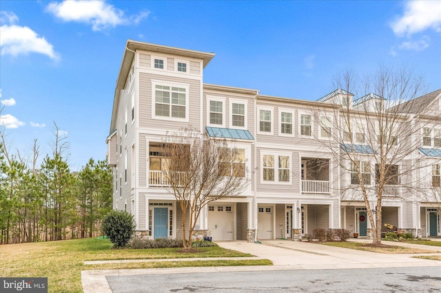 multi unit property with a garage and a front lawn