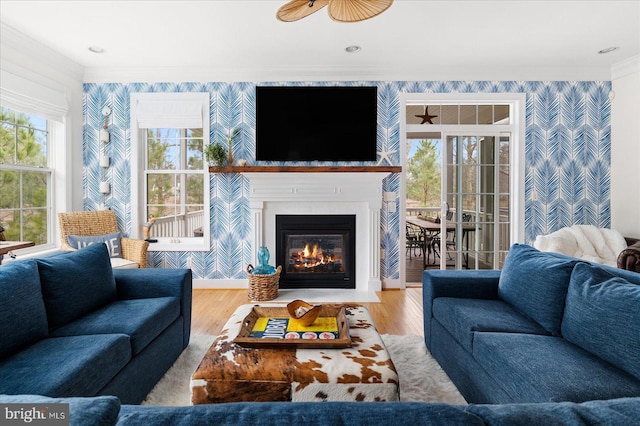 living room with ornamental molding and light wood-type flooring