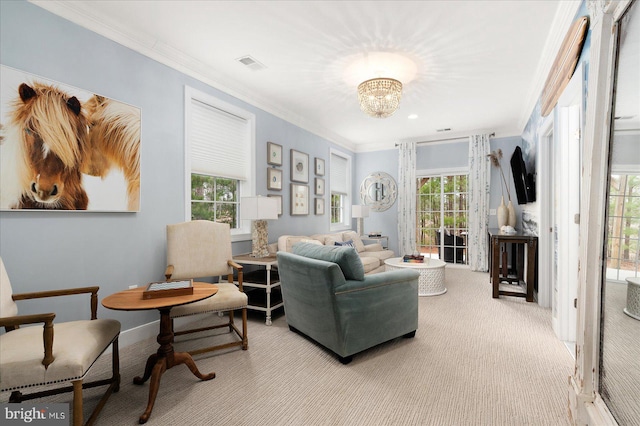 living area featuring an inviting chandelier, crown molding, and light colored carpet