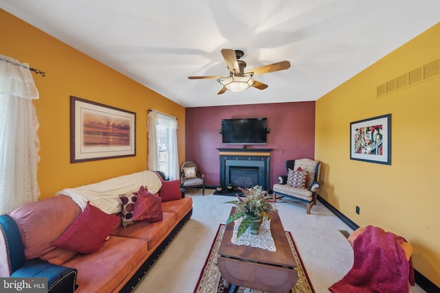 living room with carpet and ceiling fan