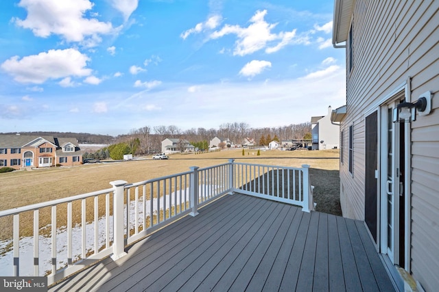 wooden deck with a lawn