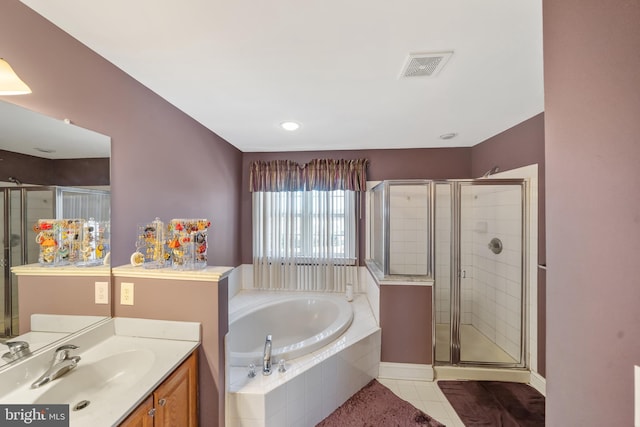 bathroom featuring vanity, tile patterned floors, and separate shower and tub