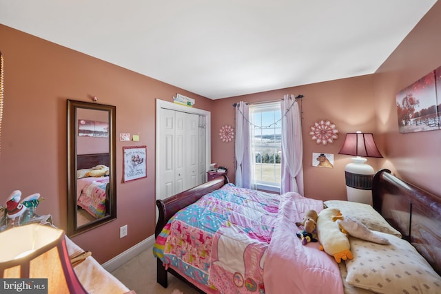 carpeted bedroom featuring a closet
