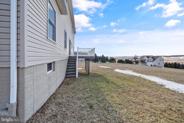 view of yard featuring a wooden deck