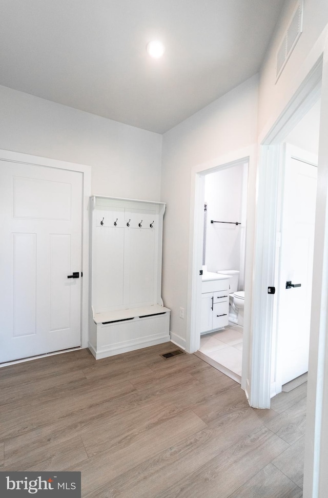 mudroom with light wood-type flooring