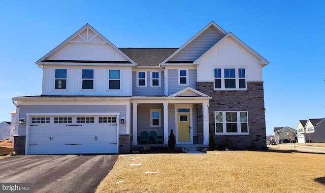 view of front facade with a garage and a porch