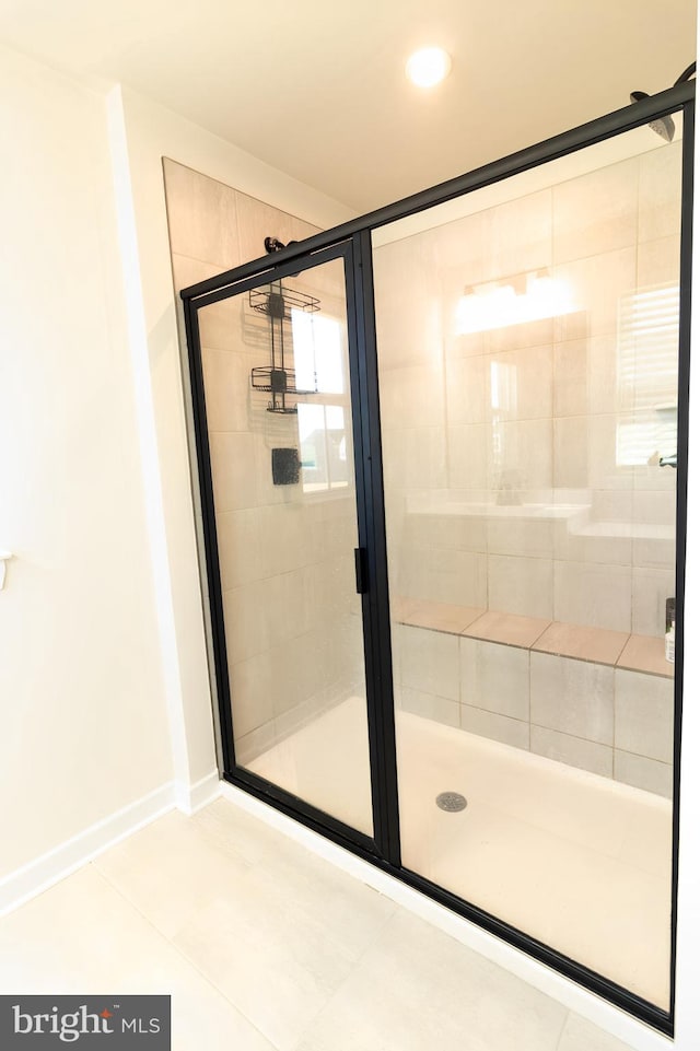 bathroom featuring tile patterned floors and walk in shower