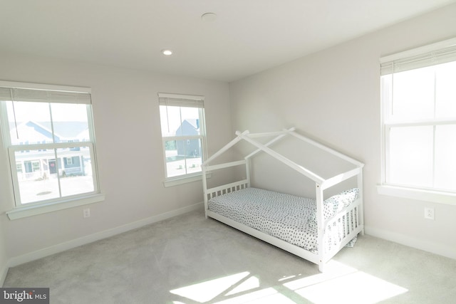 unfurnished bedroom featuring light colored carpet