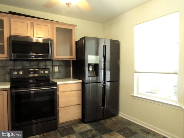 kitchen featuring tasteful backsplash, ceiling fan, and stainless steel appliances