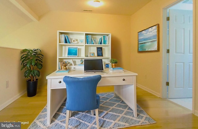 office space with light wood-type flooring