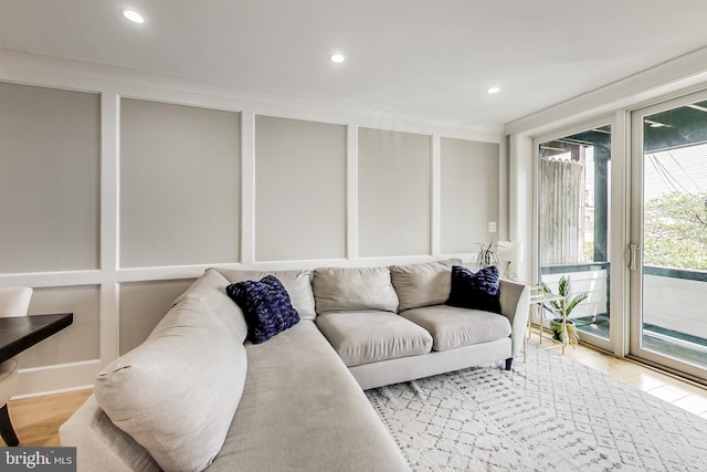 living room with ornamental molding