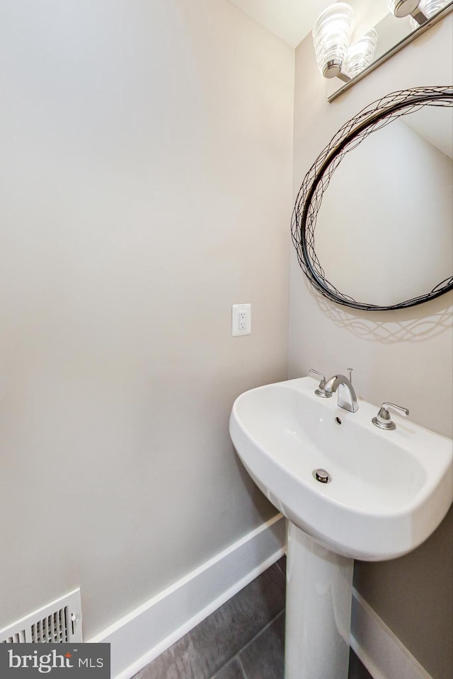 bathroom featuring tile patterned flooring and sink