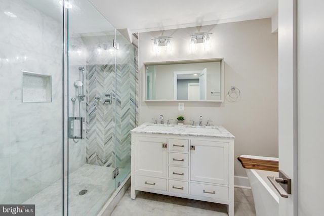 bathroom with an enclosed shower and vanity