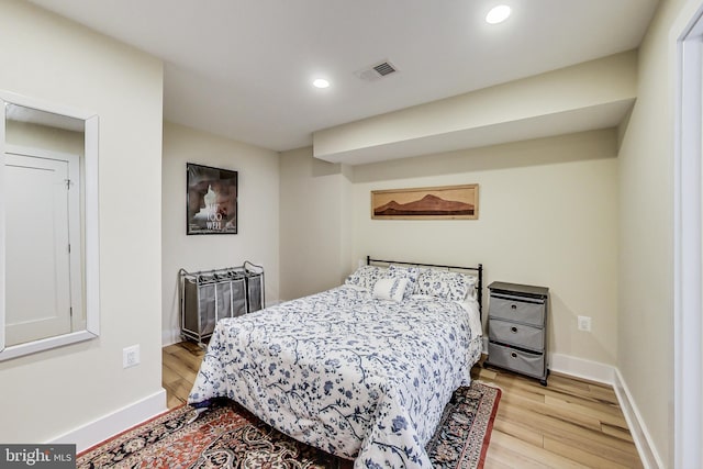 bedroom with light hardwood / wood-style flooring