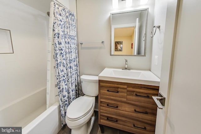 full bathroom with vanity, shower / tub combo with curtain, and toilet