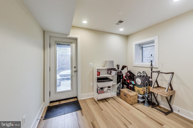 entryway with light hardwood / wood-style floors