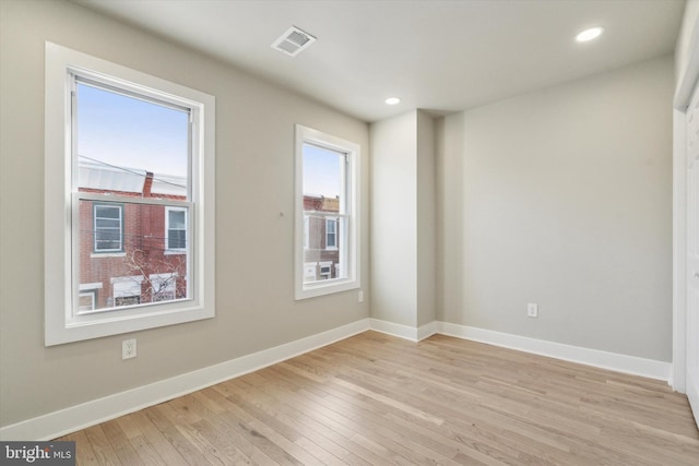 spare room featuring light hardwood / wood-style flooring