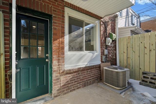 doorway to property featuring central AC unit