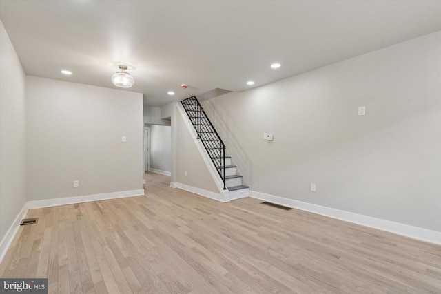 basement featuring light wood-type flooring